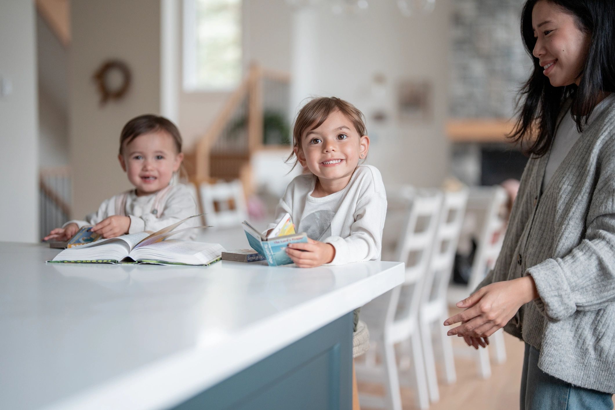 Caregiver reading with children at home